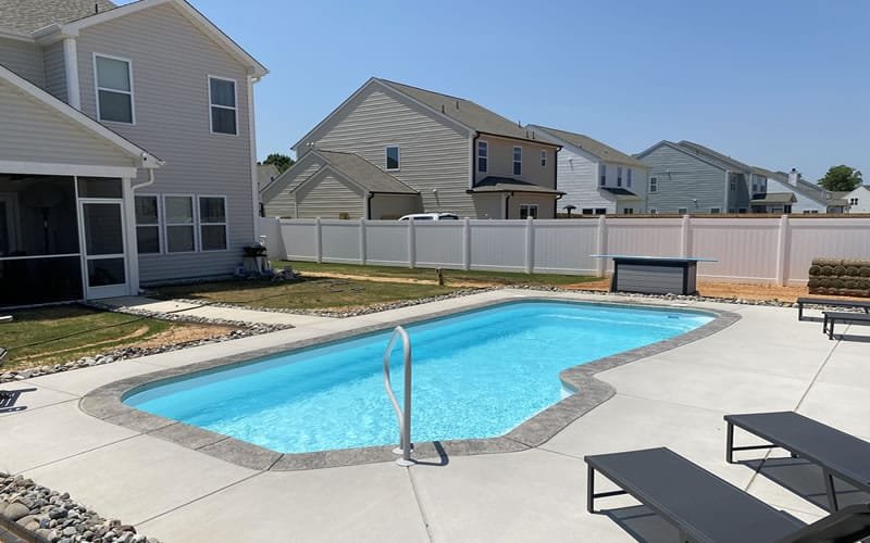 Fiberglass pool installation in Florida backyard
